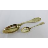 Georgian silver teaspoon and a continental silver spoon with floral engraving (2)