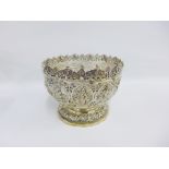 Eastern silver pedestal bowl, chased with deities and stylised motifs, with serrated top rim and