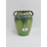 Upchurch Pottery, green glazed high shouldered vase with handles to the lugs, impressed