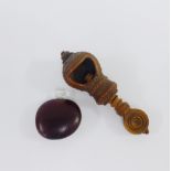 Carved coquille nut table clamp / nut crack, together with a small nut scent bottle with glass stop