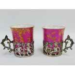 Pair of Copeland Spode pink glazed porcelain cabinet cups each within a Mappin & Webb silver cup