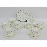 Minton bone china white glazed teaset with gilt edge rims and floral sprays, comprising six cups,