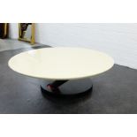 1980's circular topped coffee table on an ebonised base with sloping column, 42 x 90cm