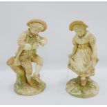 Pair of Royal Worcester blush ivory Kate Greenaway figures, modelled by James Hadley, green