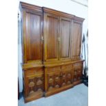 Victorian mahogany breakfront cabinet, the moulded cornice over four panelled doors enclosing a