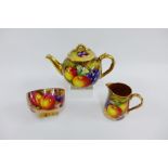 Royal Worcester fruit study teapot by Freeman, painted in the round with apples, pear and grapes