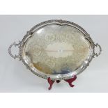 Large silver plated tray of oval outline with foliate engraved pattern and twin handles, 76cm