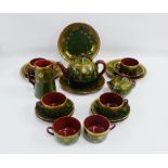 Sarreguemines green glazed pottery teaset with stylised Art Nouveau floral pattern comprising