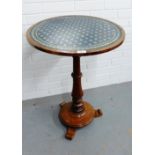 Mahogany pedestal wine table, the circular top with an inset skivver, on bun feet, 75 x 55cm