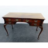 Mahogany desk, the rectangular top over two long and two short drawers, on cabriole legs, 78 x 122cm