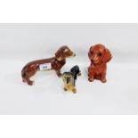 Collection of three Dachshund figures to include Avon ware, longest 18cm, (3)