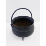 Black iron cauldron with a swing handle, 31cm across