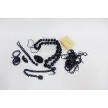 Collection of black jet jewellery , etc to include beads and pendants. (a lot)