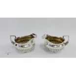 Pair of George III silver half fluted jugs, makers mark for William Burwash & Richard Sibley, London