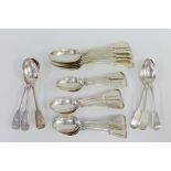 A set of silver fiddle pattern spoons to include six table spoons and seventeen smaller spoons,