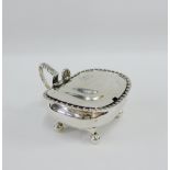 Regency silver mustard with hinged lid and acanthus leaf thumb piece, on four bun feet, London 1815,