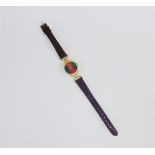 WITHDRAWN Lady's Gucci gold plated wristwatch with circular red and green dial, on a brown leather