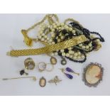 A collection of costume jewellery to include beads, pearls, dress rings, earrings and textured