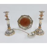 A collection of Old Sheffield plate to include a pair of candlesticks, sauce ladle and a salver (4)