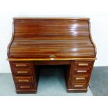 Mahogany roll top desk, the tambour front opening to reveal a fitted interior, with four drawers