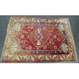 Eastern rug with red field and central medallion, 170 x 120cm