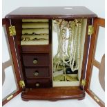 A jewellery case containing a 9 carat gold wedding band and three 9 carat gold dress rings, etc (a