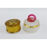 Vintage musical compact box and a frosted glass jar and cover with ruby glass snake handle, (2)