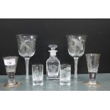 Small etched glass decanter and stoppers with a hunting figure, two shot glasses with game birds,