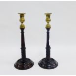 Pair of turned mahogany and brass candlesticks, 34cm high