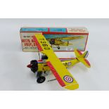 Japanese battery operated tin plate Bristol Bulldog Aircraft, with flashing engine and automatic