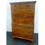 Oak chest on chest, the rectangular top with a dentil frieze over two short and six long drawers,