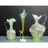 Collection of green vaseline glass to include two jugs with pink flowers and another of Jack-in-