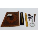 Mixed lot of bisque and stationary items to include a leather blotter, rulers, agate seal,