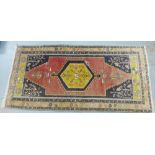 Eastern rug with hexagonal medallion to centre, 202 x 102cm