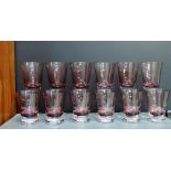 Set of six wine glasses and six beakers, each with aubergine coloured bowls, (12)