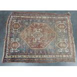 Eastern rug with worn blue field 140 x 112cm