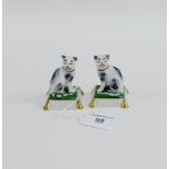 Pair of porcelain black and white cats on cushion bases, 6cm high, (2)