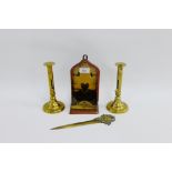 Pair of 19th century brass candlesticks with pushers, together with a brass mounted wooden candle