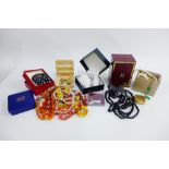 A quantity of costume jewellery to include beads, brooches, wristwatches, etc (a lot)