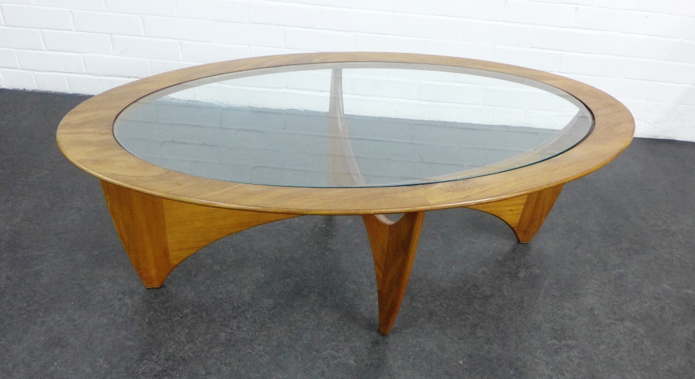 Teak coffee table, with oval glass insert and cross stretcher base 42 x 122cm