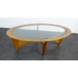 Teak coffee table, with oval glass insert and cross stretcher base 42 x 122cm