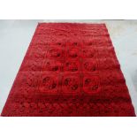 Bokhara rug the red field with three rows of five octagons, 290 x 205cm