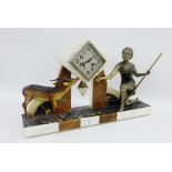 Art Deco hardstone mantle clock with a Spelter figure of a female and a Gazelle, complete with