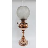 Art Nouveau copper oil lamp with etched glass globular shade