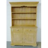 Pine dresser with shelved plate back above two short drawers and two cupboard doors, 200 x 125cm