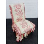 Bedroom chair with red and white floral loose cover