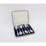 Set of six Walker & Hall 'golfing' silver teaspoons, Sheffield 1933, in fitted case, (6)