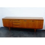Greaves & Thomas teak sideboard credenza, with three doors and three drawers on shaped supports,