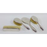 George V silver backed dressing table brush set comprising two hair brushes, clothes brush and
