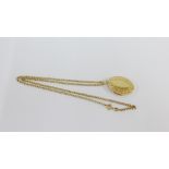 9 carat gold locket suspended on a 9 carat gold belcher chain, both stamped 375